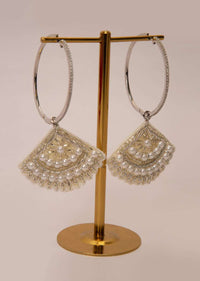 Silver hoop earring with a fabric based drops