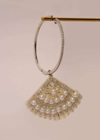 Silver hoop earring with a fabric based drops