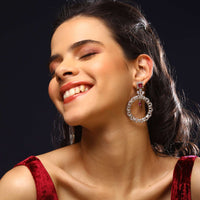Silver Earrings With Swarovski Stones Studded In Round Motif And Maroon Stone Accent