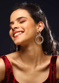 Silver Earrings With Swarovski Stones Studded In Round Motif And Maroon Stone Accent