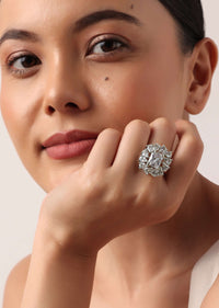Silver Finish Ring With Emerald Cut Stones In Floral Motif