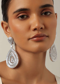 Silver Finish Statement Danglers With Zirconia Stones And Teardrop Motif