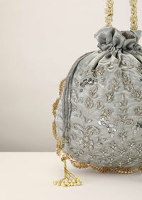 Silver Grey Potli In Satin Silk With Hand Embroidery Detailing Using Zardosi Work In Floral Design All Over
