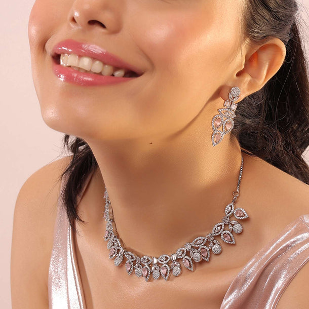 Silver Leaf-Flower Shaped Necklace With Earrings Studded In Bubble-Gum Pink Along With White Stones