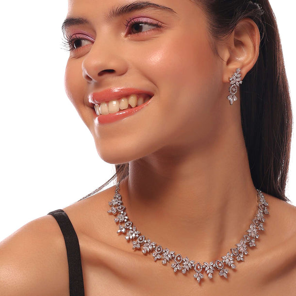 Silver Necklace And Earrings Set With White Stone Finish In A Floral Design