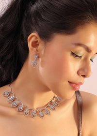 Silver Necklace And Earrings With Flower-In-A-Leaf Design Embedded With White Stones