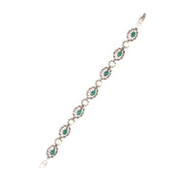 Silver Plated Bracelet With Carved Flowers And Embellished With Green Gemstone And Pearls Made In Sterling Silver By Sangeeta Boochra