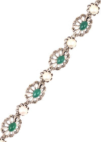 Silver Plated Bracelet With Carved Flowers And Embellished With Green Gemstone And Pearls Made In Sterling Silver By Sangeeta Boochra