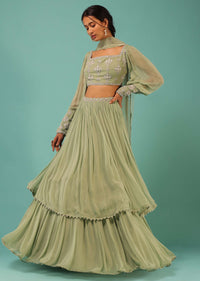 Powder Green Layered Lehenga And Crop Top With Balloon Sleeves And Cut Dana Detailing