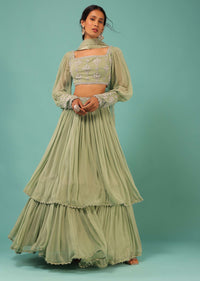 Powder Green Layered Lehenga And Crop Top With Balloon Sleeves And Cut Dana Detailing