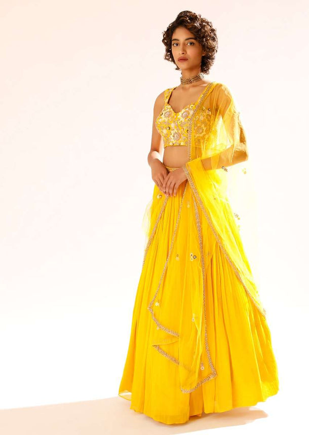 Sun Yellow Gathered Lehenga With Hand Embroidered Blouse Using Sequins And Cut Dana In Floral Motifs