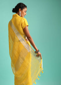 Sun Yellow Saree In Linen With Silver Brocade Border And Striped Pallu Along With A Matching Unstitched Blouse