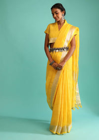 Sun Yellow Saree In Linen With Silver Brocade Border And Striped Pallu Along With A Matching Unstitched Blouse