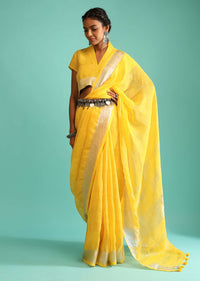 Sun Yellow Saree In Linen With Silver Brocade Border And Striped Pallu Along With A Matching Unstitched Blouse