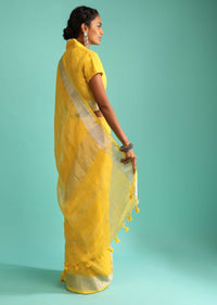 Sun Yellow Saree In Linen With Silver Brocade Border And Striped Pallu Along With A Matching Unstitched Blouse