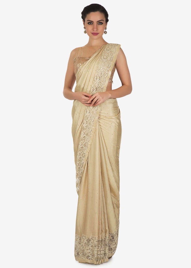 Tan cream saree with Chantilly lace and kundan embroidery only on Kalki