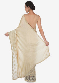 Tan cream saree with Chantilly lace and kundan embroidery only on Kalki