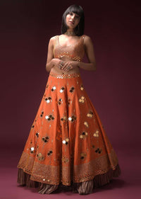 Tangerine Orange Lehenga Choli In Raw Silk Heavily Embroidered Using Geometric Cut Mirrors And Zari Work