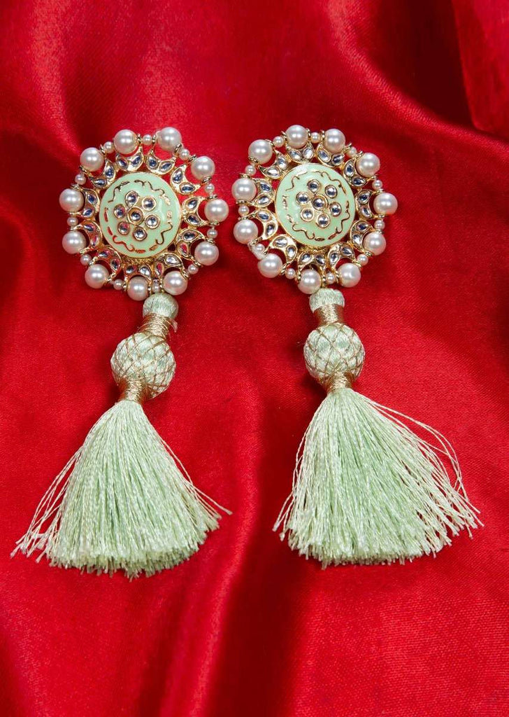 Tasseled cluster earing adorn with pearls and kundan work only on kalki