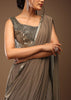 Taupe Grey Ready-Pleated Saree With A Crop Top In Foil Applique Embellishment Sleeveless With A Tie-Up Tassel Dori At The Back.