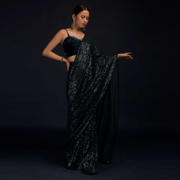Teal Blue Ready Pleated Saree Embellished In Sequins With A Matching Velvet Blouse With Corset Neckline