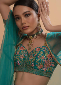 Teal Drape Skirt And Crop Top With Matching Cape And Colorful Resham Embroidered Spring Blooms