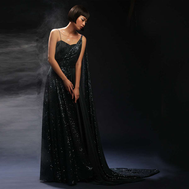 Teal Gown Embellished In Sequins With Drape Design On The Bodice And Extended Cape On One Shoulder