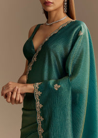 Teal Green Crushed Tissue Saree With Cutdana Embroidery And Scallop Border