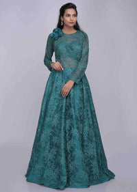 Teal green ethnic gown in fancy floral lace fabric only on Kalki