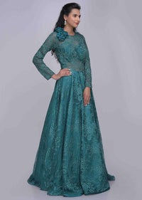Teal green ethnic gown in fancy floral lace fabric only on Kalki