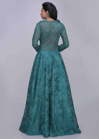 Teal green ethnic gown in fancy floral lace fabric only on Kalki