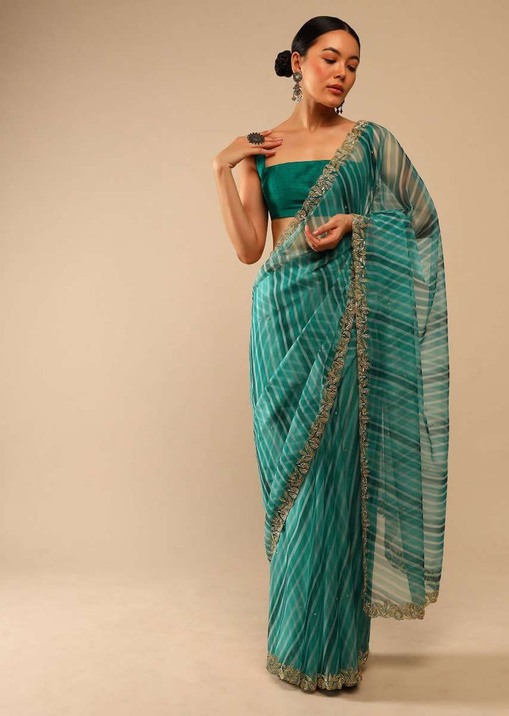 Teal Green Saree In Organza With Lehariya Print And Hand Embroidered Border With Beads And Sequins Work