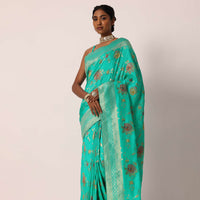 Teal Saree In Banarasi Silk With Floral Motifs And Unstitched Blouse Piece