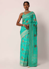 Teal Saree In Banarasi Silk With Floral Motifs And Unstitched Blouse Piece