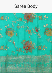 Teal Saree In Banarasi Silk With Floral Motifs And Unstitched Blouse Piece