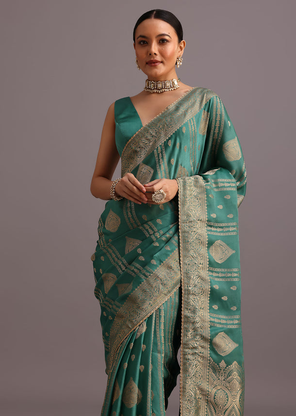 Teal Zari Work Satin Silk Woven Saree And Brocade Border