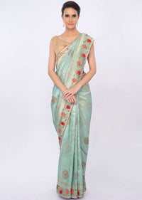 Turq blue banarasi brocade saree in checks and floral motif only on kalki