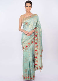 Turq blue banarasi brocade saree in checks and floral motif only on kalki