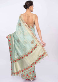 Turq blue banarasi brocade saree in checks and floral motif only on kalki