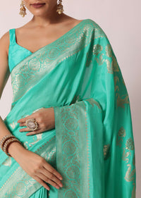 Turquoise Banarasi Saree With Floral Jaal Zari Pallu And Unstitched Blouse Piece