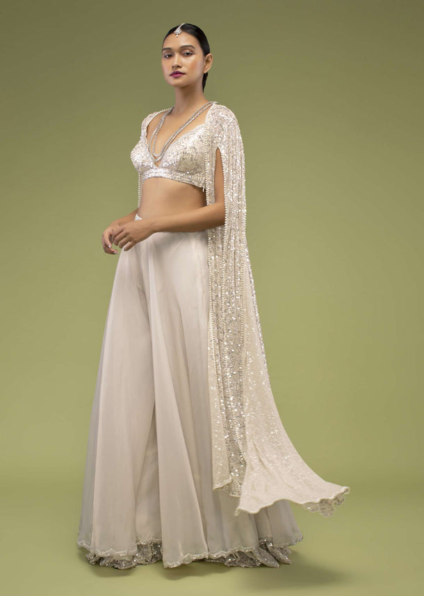 Turtledove White Sharara Suit In Sequins Embroidery, Paired With A Long Embroidery Cape