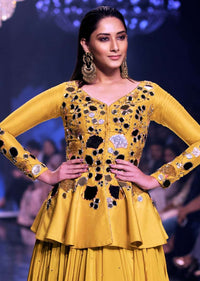 Sunset Yellow Peplum Top With Flower And Leaf Cut Mirror Work And Matching Lehenga