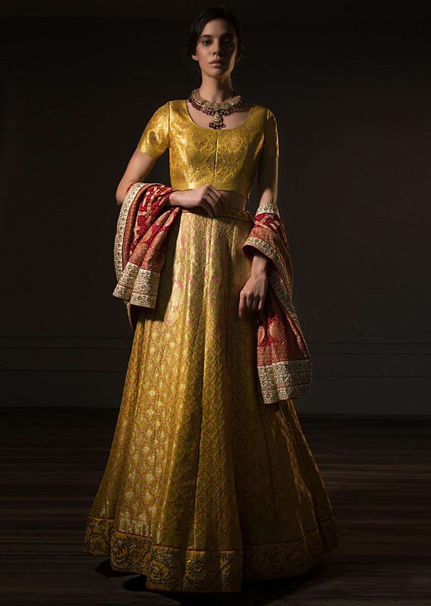 Tuscan Yellow Brocade Lehenga Set With Red Bandhani Dupatta Online - Kalki Fashion