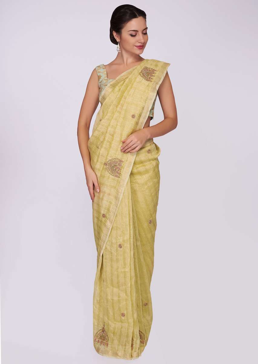 Tussar silk beige saree in embroidered butti 