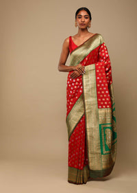 Vermillion Red Saree In Art Handloom Silk With Green Woven Border And Two Toned Buttis Along With Unstitched Blouse