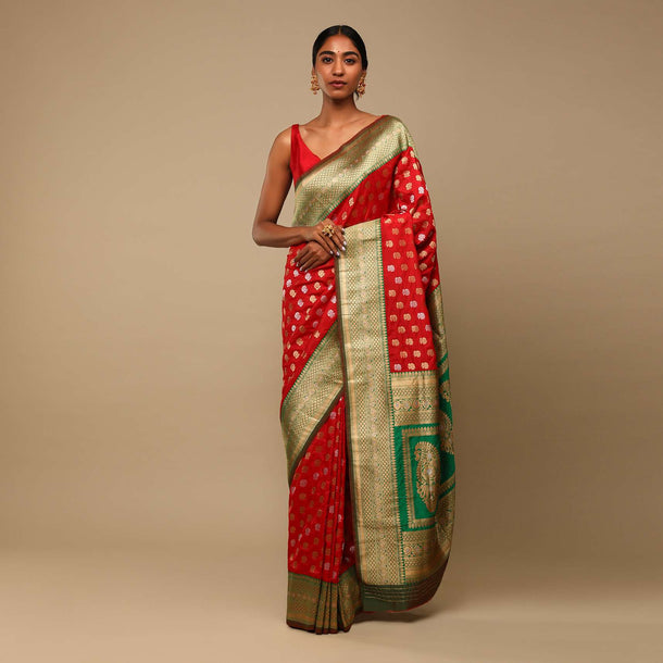 Vermillion Red Saree In Art Handloom Silk With Green Woven Border And Two Toned Buttis Along With Unstitched Blouse