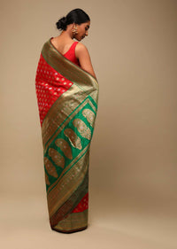 Vermillion Red Saree In Art Handloom Silk With Green Woven Border And Two Toned Buttis Along With Unstitched Blouse