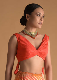 Vermillion Orange Blouse In Raw Silk With Pleat Details On The Front And Back Along With Tassels On The Sides