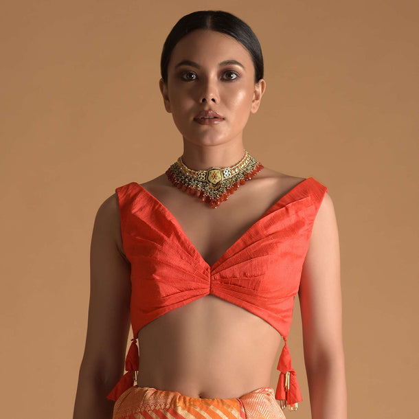 Vermillion Orange Blouse In Raw Silk With Pleat Details On The Front And Back Along With Tassels On The Sides