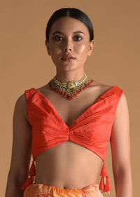 Vermillion Orange Blouse In Raw Silk With Pleat Details On The Front And Back Along With Tassels On The Sides